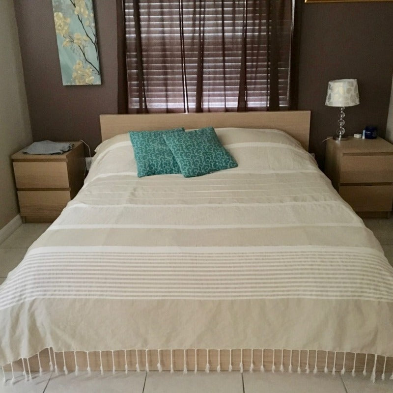 Extra large cotton fouta on a queen bed